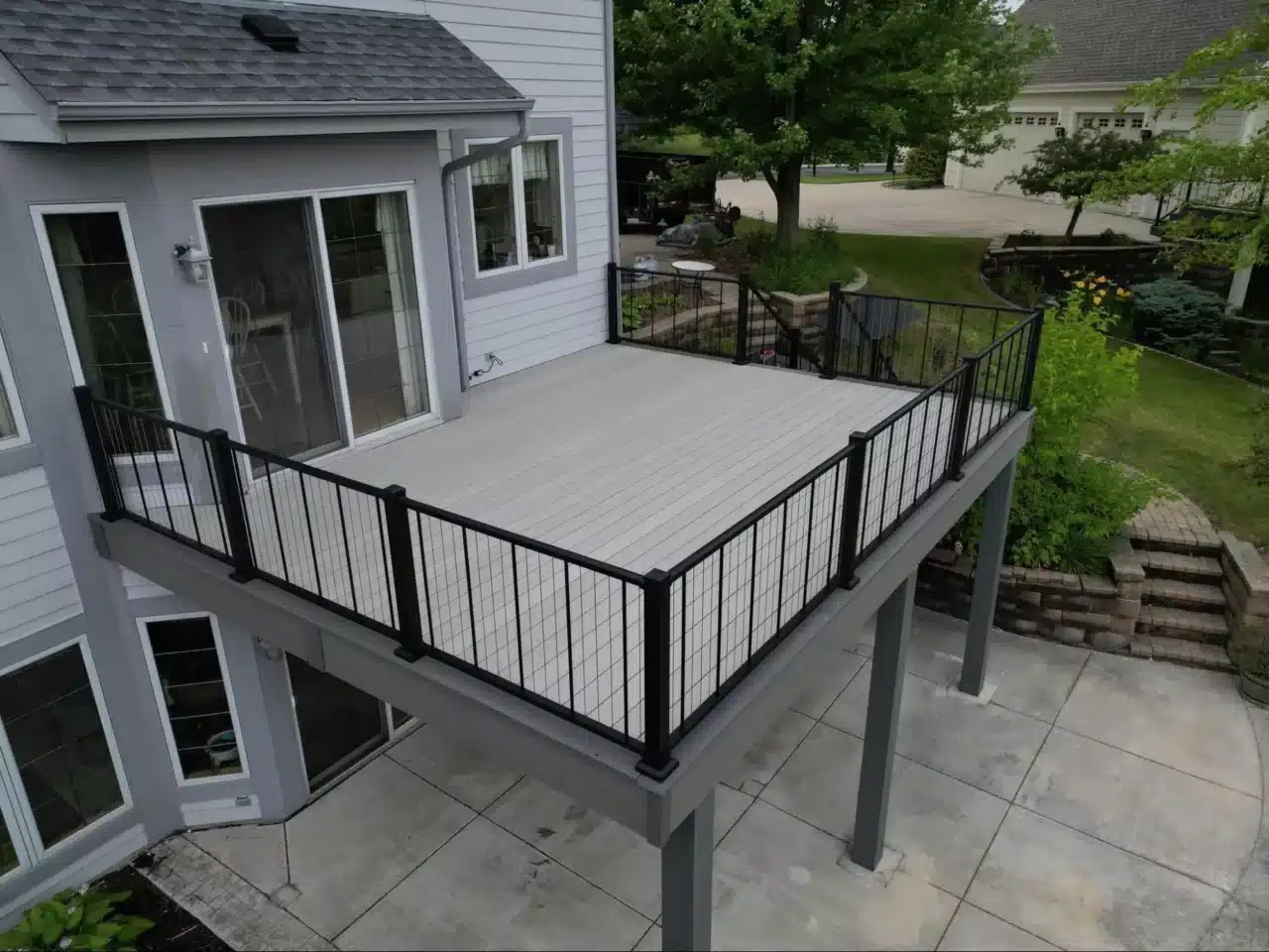 Elevated Deck with Black Metal Railing and Under Deck Area