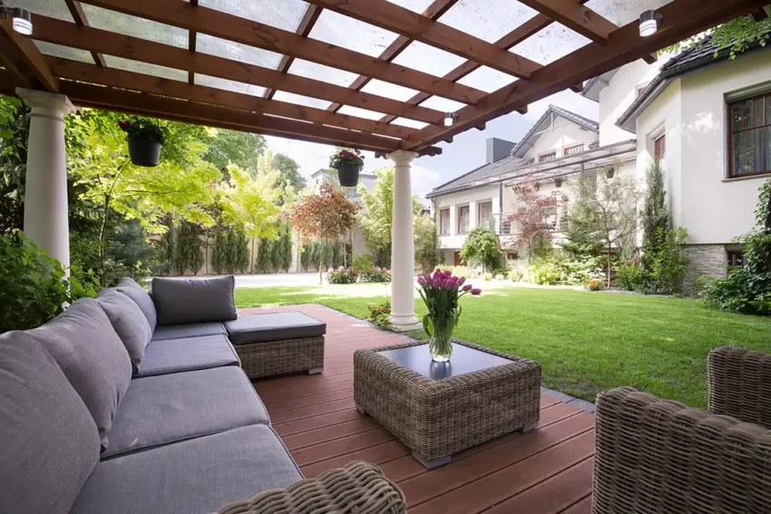 Deck cover ideas Photo of a pergola with canopy covering a wood deck with outdoor furniture.