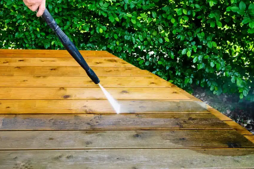 deck being pressure washed on a deck stripping process