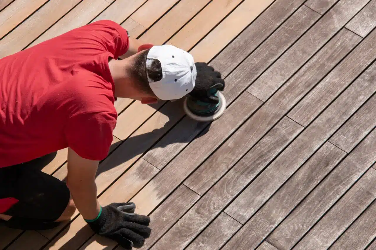 man working on deck stripping - Importance and benefits of deck stripping