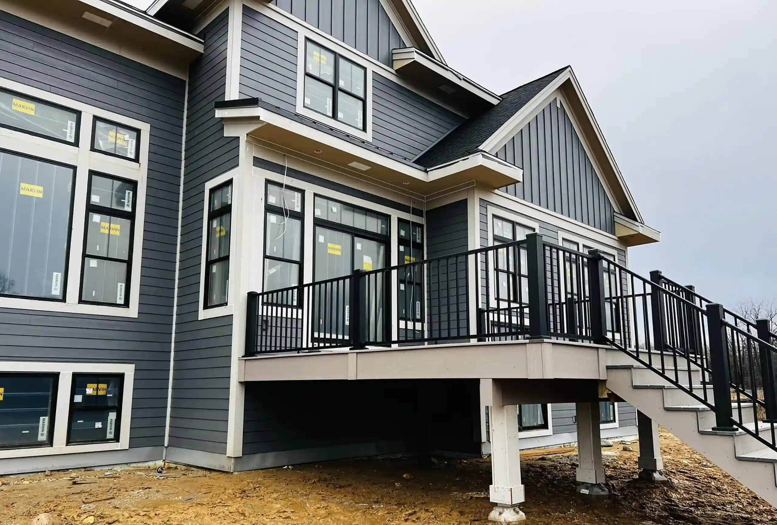 photo of a deck with deck railing and steps that could also serve as a porch - Defining a deck vs a porch