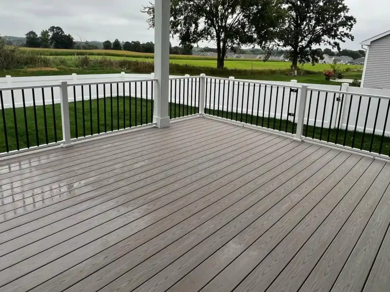 Front View of Photo of Covered Porch with Composite Deck Boards, Deck Railing and Ceiling Fan