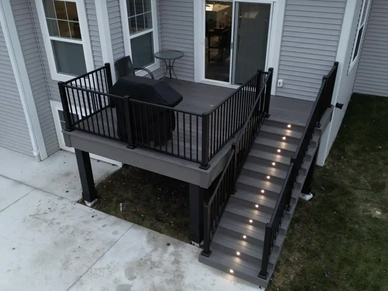 photo of a raised deck with deck railing and steps to accompany a story about the difference between a deck and a porch